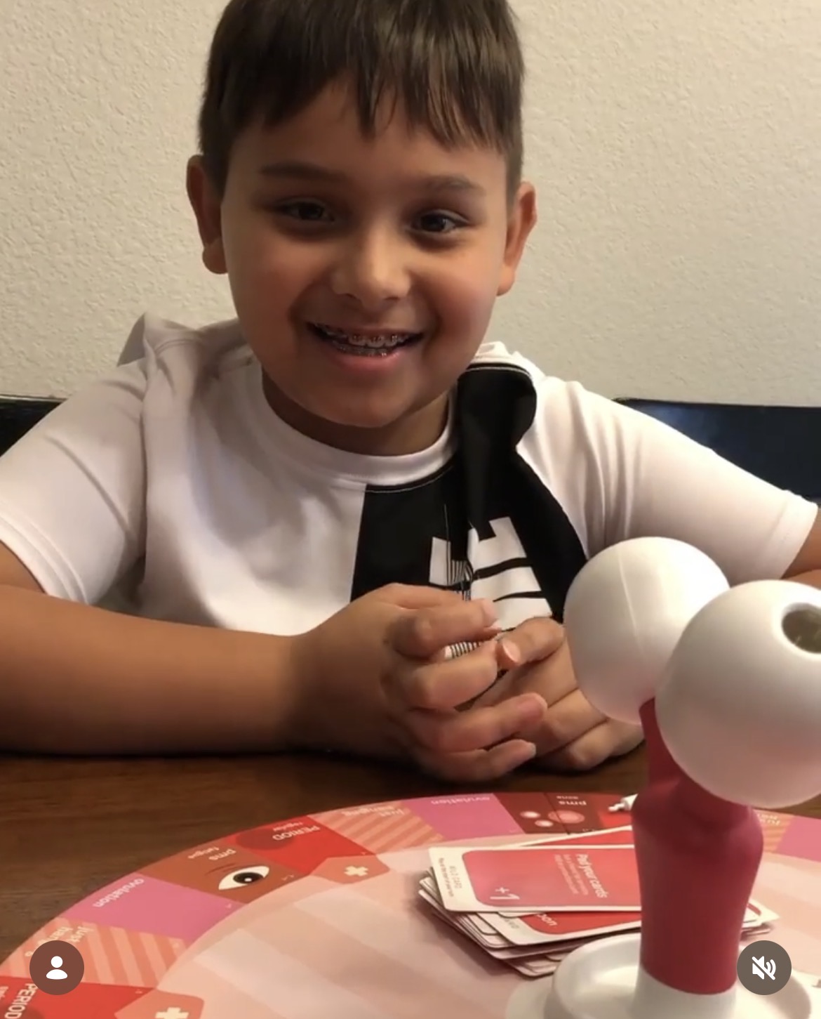 Child smiling with the game board