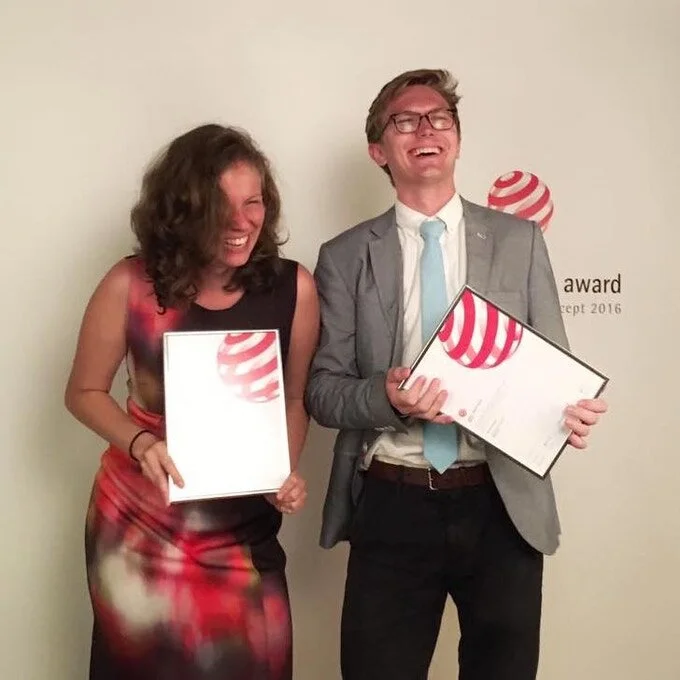 Daniela and Ryan accepting the Red Dot Award